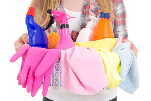 Professional cleaner preparing supplies for move out cleaning